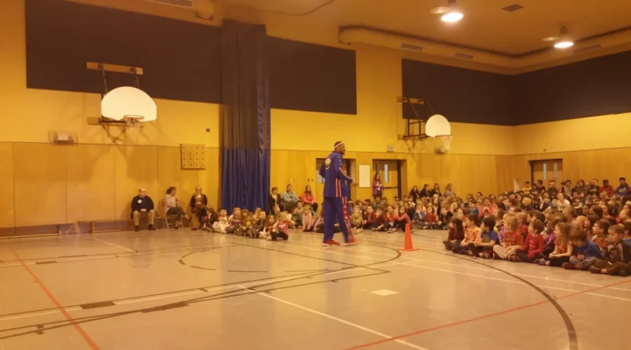 Harlem Globetrotter Visits Local School For Bullying Prevention Presentation