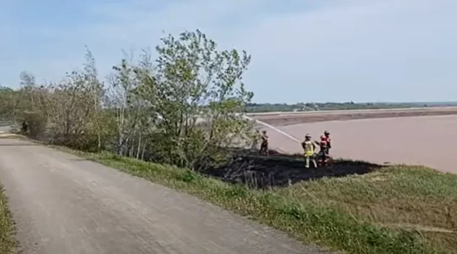 Emergency responders battle grass fire in Dieppe