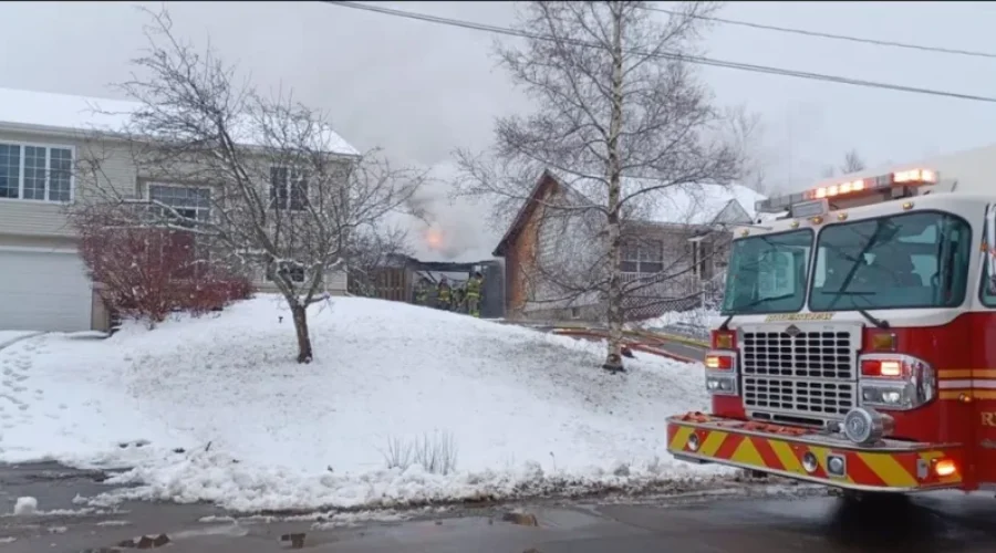Fire destroys garage, damages home