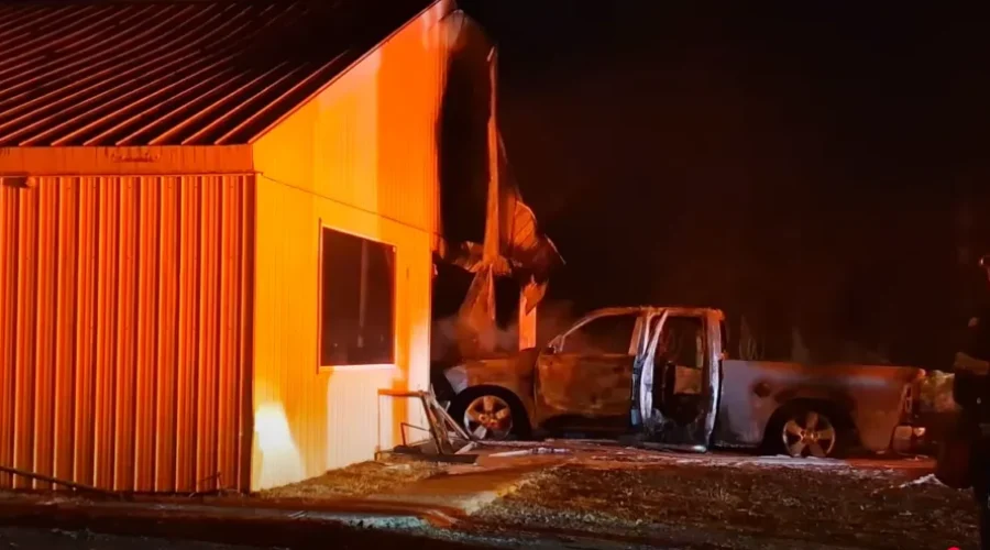 Fire damages garage and pickup truck